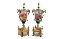 Lot 1822 - A PAIR OF BRASS AND CERAMIC GARNITURE VASES
