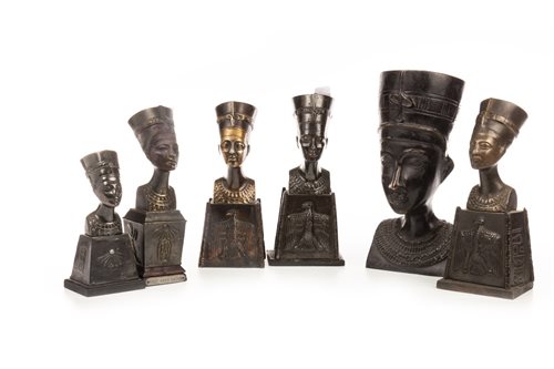 Lot 1827 - A CAST BRONZE BUST OF NEFERTITI AND FIVE SMALLER BUSTS
