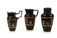 Lot 1861 - A PAIR OF DOULTON ‘EGYPTIAN REVIVAL’ JUGS AND ANOTHER