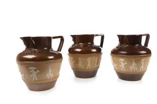 Lot 1870 - A LOT OF THREE DOULTON ‘EGYPTIAN REVIVAL’ CIDER JUGS