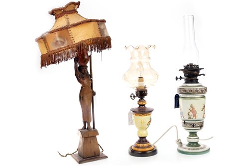 Lot 1891 - A LLADRO FIGURE OF A WATER CARRIER AND FOUR LAMPS