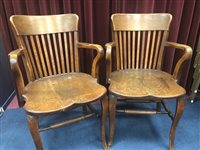 Lot 257 - A PAIR OF OAK BUSINESS OPEN ELBOW CHAIRS
