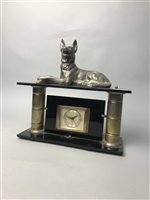 Lot 302 - A METAL AND GLASS MANTEL CLOCK