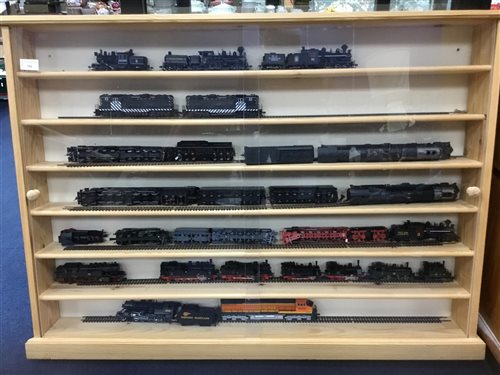 Lot 284 - A WALL MOUNTED DISPLAY OF TRAINS