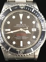 Lot 755 - A RARE ROLEX DOUBLE RED SEA-DWELLER SUBMARINER