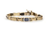 Lot 285 - A GOLD BRACELET SET WITH BLUE AND WHITE GEMS