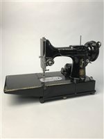 Lot 85 - A SINGER SEWING MACHINE AND A LEATHER SATCHEL