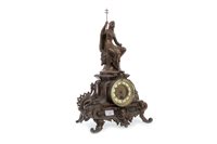 Lot 1979 - A MANTEL CLOCK MOUNTED WITH A FIGURE OF A PHARAOH