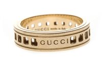 Lot 80 - A GOLD SPINNING GUCCI RING