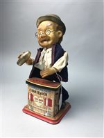 Lot 326 - A CHARLEY WEAVER BATTERY OPERATED BARTENDER WITH TWO TRUCKS
