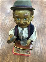 Lot 326 - A CHARLEY WEAVER BATTERY OPERATED BARTENDER WITH TWO TRUCKS