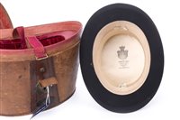 Lot 921 - A BLACK SILK TOP HAT IN LEATHER CASE