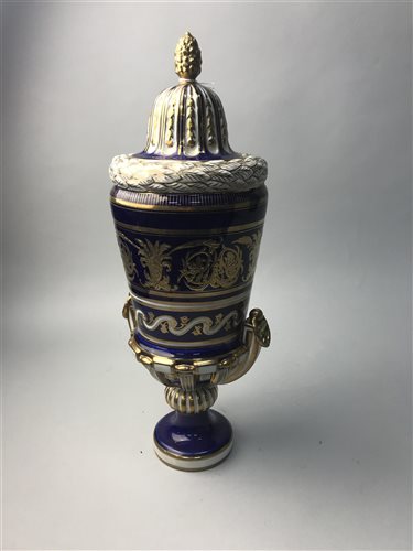 Lot 83 - A PAIR OF CONTINENTAL BLUE, WHITE AND GILT LIDDED URNS