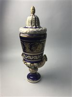 Lot 83 - A PAIR OF CONTINENTAL BLUE, WHITE AND GILT LIDDED URNS