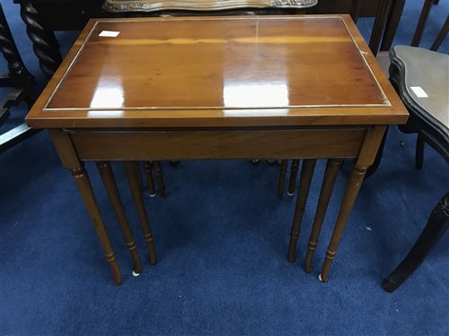 Lot 213 - A YEW WOOD NEST OF THREE TABLES