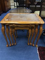 Lot 224 - A  YEW WOOD NEST OF FOUR TABLES