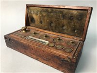 Lot 189 - A SMALL CASED SET OF SCALE WEIGHTS