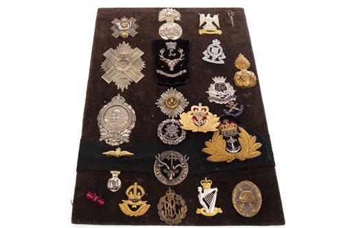 Lot 949 - A BOARD OF MOSTLY SCOTTISH CAP BADGES