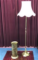 Lot 124 - A BRASS STANDARD LAMP AND A STICK STAND