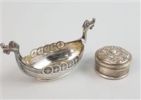 Lot 128 - A SMALL SILVER LONG BOAT AND A SILVER PILL BOX