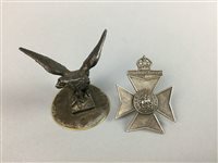 Lot 243 - A LOT OF BADGES AND AN EAGLE FINIAL