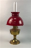 Lot 374 - A BRASS OIL LAMP