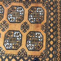 Lot 390 - A LARGE AFGHAN RUG