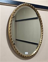 Lot 408 - AN OVAL MIRROR IN GILT FRAME