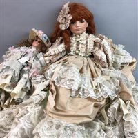 Lot 450 - A LARGE BISQUE PORCELAIN HEADED DOLL AND A SMALLER DOLL
