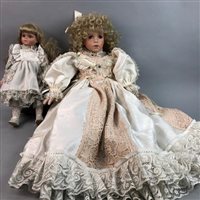 Lot 449 - A LARGE BISQUE PORCELAIN HEADED DOLL AND A SMALLER DOLL