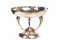 Lot 839 - AN EDWARDIAN ARTS & CRAFTS HAMMERED SILVER TAZZA
