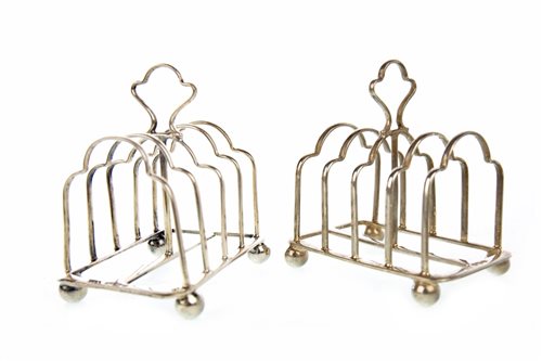 Lot 841 - A SMALL PAIR OF SILVER TOAST RACKS