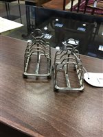 Lot 841 - A SMALL PAIR OF SILVER TOAST RACKS