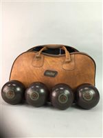 Lot 59 - FOUR LAWN BOWLS CONTAINED IN CARRY BAG