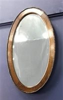 Lot 117 - AN OVAL OVER MANTEL MIRROR