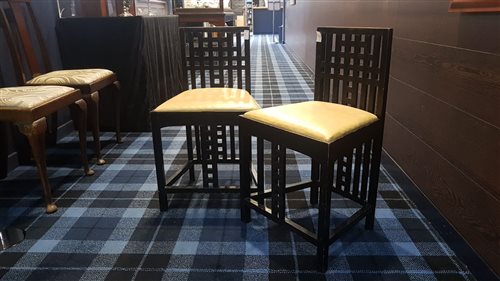 Lot 37 - A PAIR OF EBONISED SINGLE CHAIRS IN THE MANNER OF CHARLES RENNIE MACKINTOSH