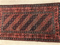 Lot 1010 - A CAUCASIAN BORDERED RUG