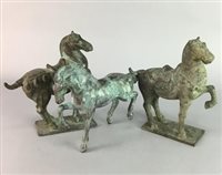 Lot 132 - A LOT OF THREE CHINESE TANG DYNASTY STYLE BRONZE HORSES