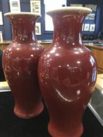 Lot 1059 - A PAIR OF CHINESE SANG DE BOEUF VASES
