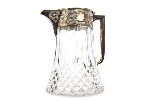 Lot 850 - A SILVER PLATED AND CUT GLASS CLARET JUG