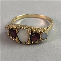Lot 329 - AN OPAL AND GEM SET RING