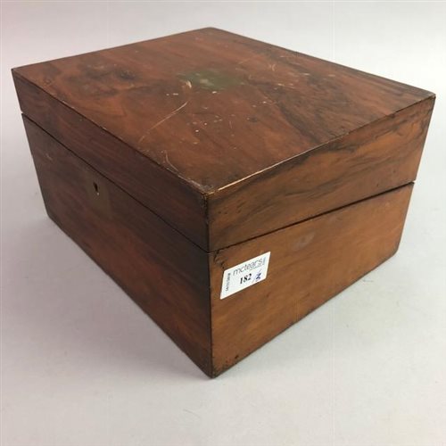 Lot 182 - A WALNUT LAP DESK WITH TWO GENT'S TRAVEL VANITY SETS