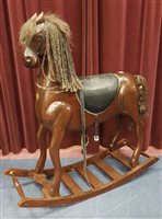 Lot 261 - A PAINTED ROCKING HORSE