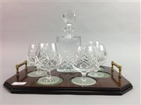 Lot 256 - A CRYSTAL DECANTER WITH GLASSES AND A SERVING TRAY