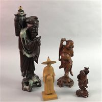 Lot 287 - A CHINESE CARVED HARDWOOD FIGURE OF A FISHERMAN WITH THREE OTHER CARVED WOOD FIGURES