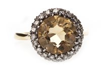 Lot 263 - A YELLOW GEM AND DIAMOND RING