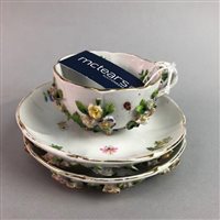 Lot 135 - AN ERNST BOHNE FLORAL ENCRUSTED CUP AND SAUCER
