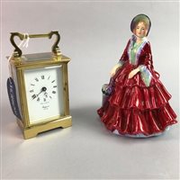 Lot 29 - A BRASS RAPPORT CARRIAGE CLOCK AND A PARAGON FIGURE