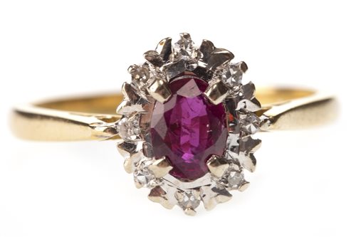 Lot 304 - A RED GEM AND DIAMOND RING
