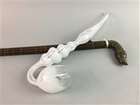 Lot 182 - A WALKING STICK AND A GLASS PIPE